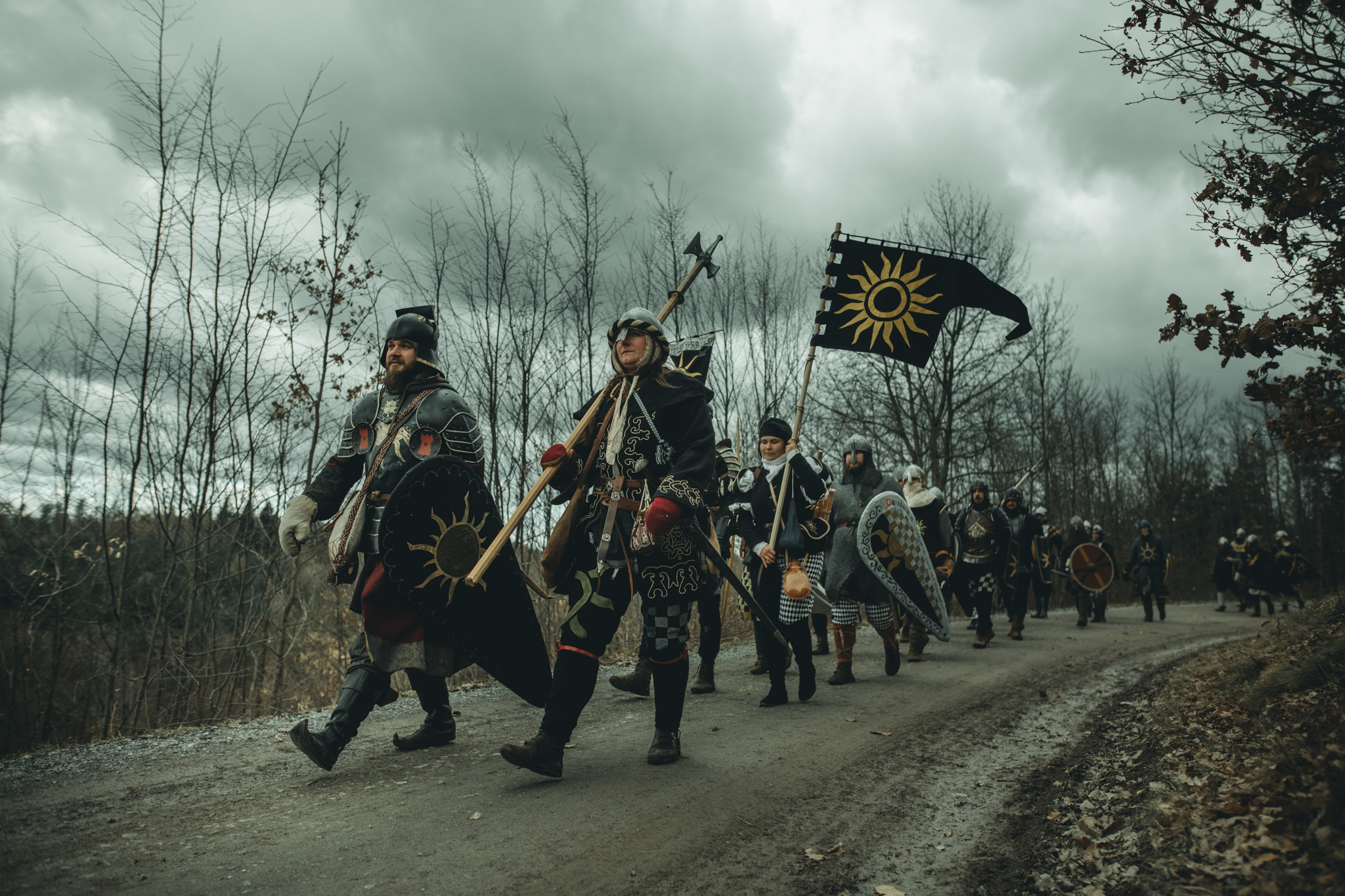 Adeptus LARP fighters marching with a banner